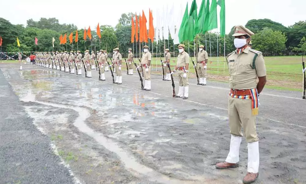 Rainwater enters Police Parade Grounds even as police take part in I-Day parade rehearshal in Guntur on Friday
