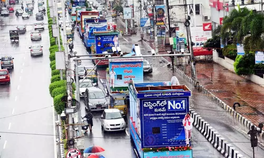 Tableaus extolling the achievements of the state government in tackling Covid-19 pass through roads in Vijayawada on Saturday