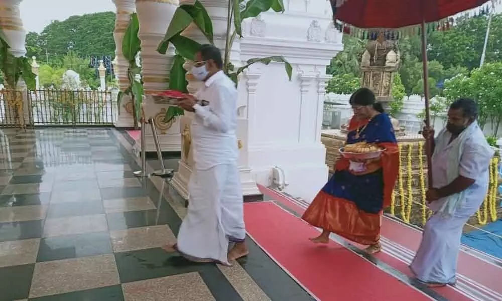 Kommareddy Bapi Reddy and his spouse Vijayabhaskaramma at the Sri Venkateswara Swamy temple at Dokiparru during Varalakshmi Vratam