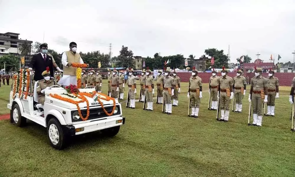 Tourism Minister M Srinivasa Rao and District Collector V Vinay Chand taking part in Independence Day parade at police barracks in Visakhapatnam  on Saturday
