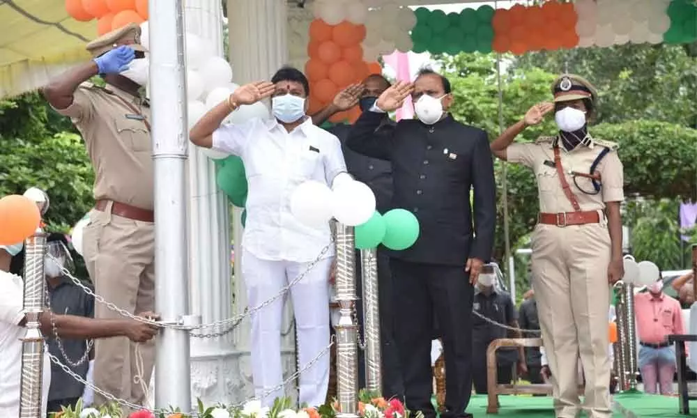 In-charge Minister V Srinivas receiving guard of honour from Armed Reserve police in Vizianagaram as part of the Independence Day celebrations on Saturday. District Collector M Hari Jawaharlal and SP B Rajakumari are also seen.