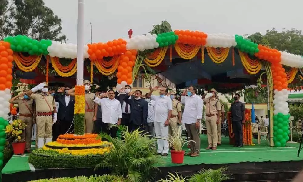 Minister P Viswaroop, MP Magunta Srinivasulu Reddy, Collector Pola Bhaskara and SP Siddharth Kaushal  saluting national flag at Independence Day celebrations in Ongole on Saturday