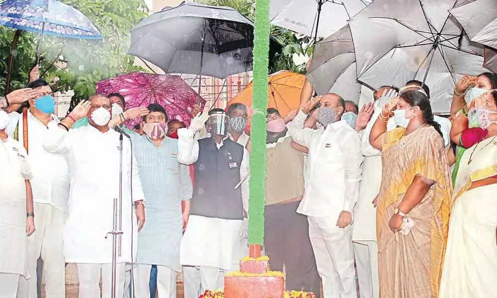 BJP State president Bandi Sanjay Kumar saluting the national flag after unfurling it at the party headquarters in Hyderabad on Saturday