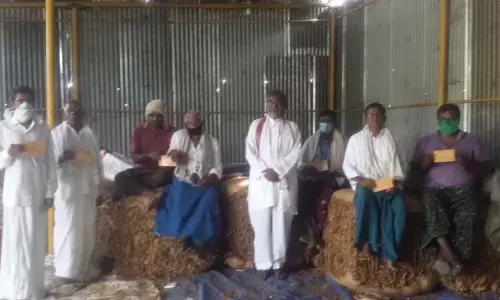 Tobacco farmers meeting at the auction centre in Ongole on Monday