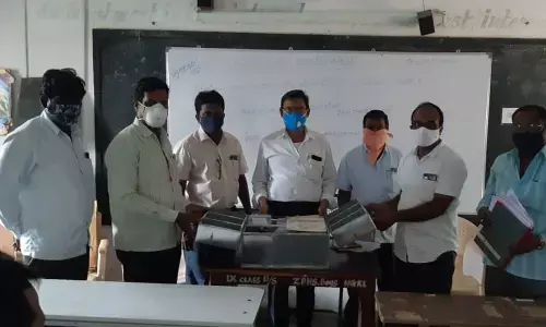 DEO Govind Rajulu distributing Math and Science kits to the teachers of various government schools