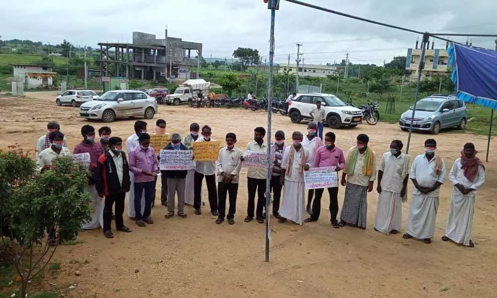Leaders of various parties staging a protest in front of Narayanpet District Collectorate on Tuesday