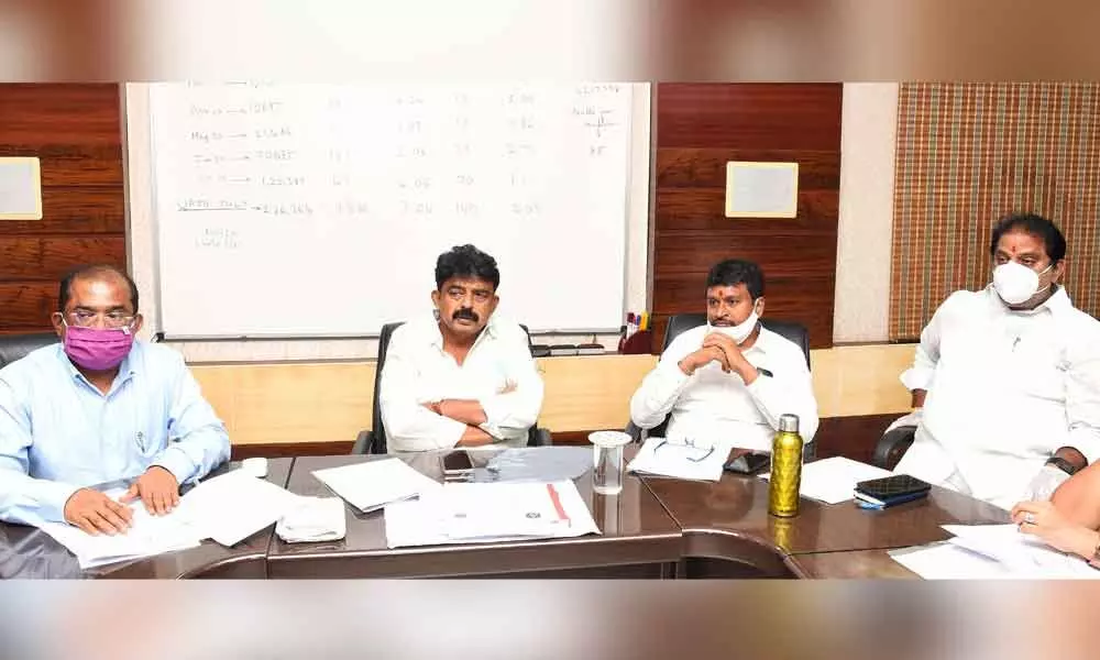 Minister Perni Nani holding a meeting with officials at the District Collector’s camp office in Vijayawada on Tuesday