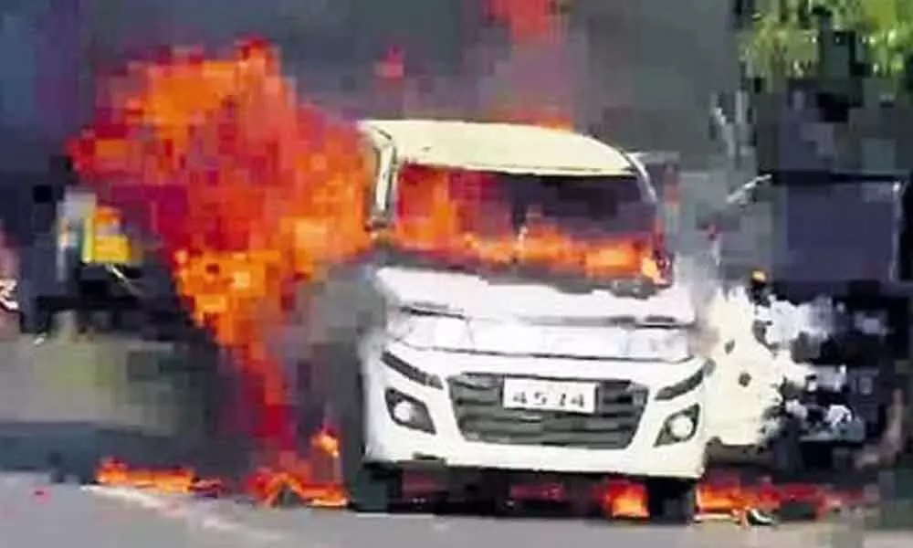 The car set ablaze by the accused in Vijayawada on Monday