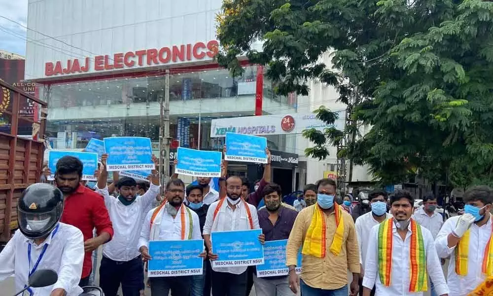 NSUI leaders Ritish Rao and Lalith, along with others, taking out a rally to protest against the arrest of NSUI State president Venkat Balmoor and 30 others, at ECIL Crossroads on Tuesday