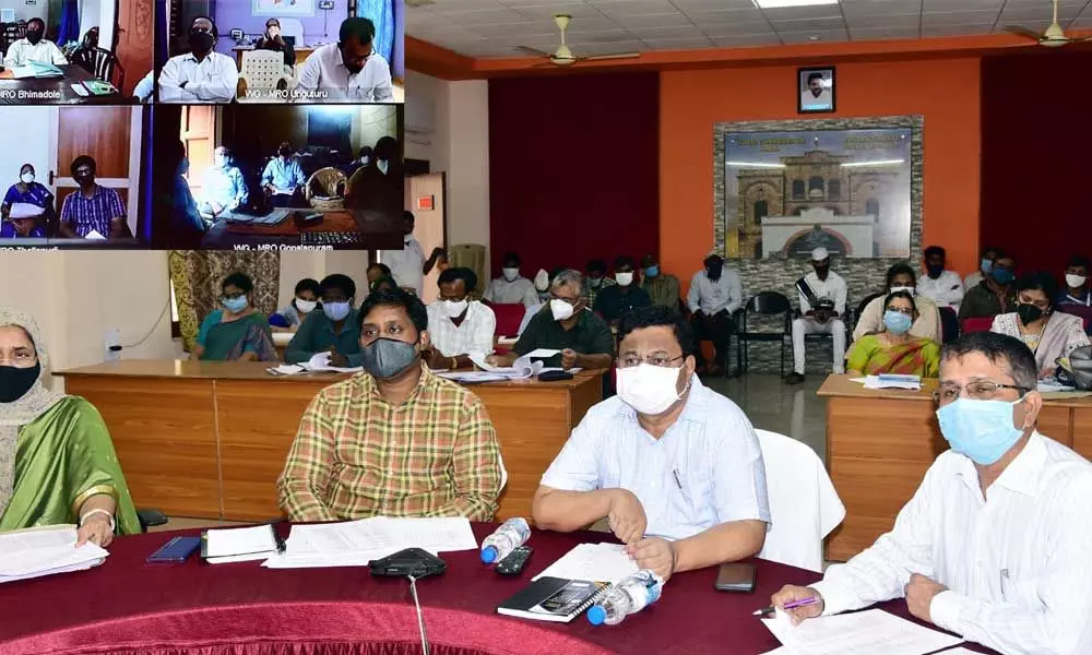 Joint Collector K Venkataramana Reddy conducting videoconference with officials in Eluru on Wednesday