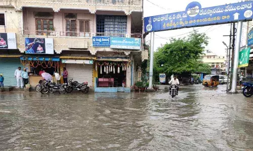 Waterlogged road in front of Sri Raja Rajaswara Swamy temple in Vemulawada
