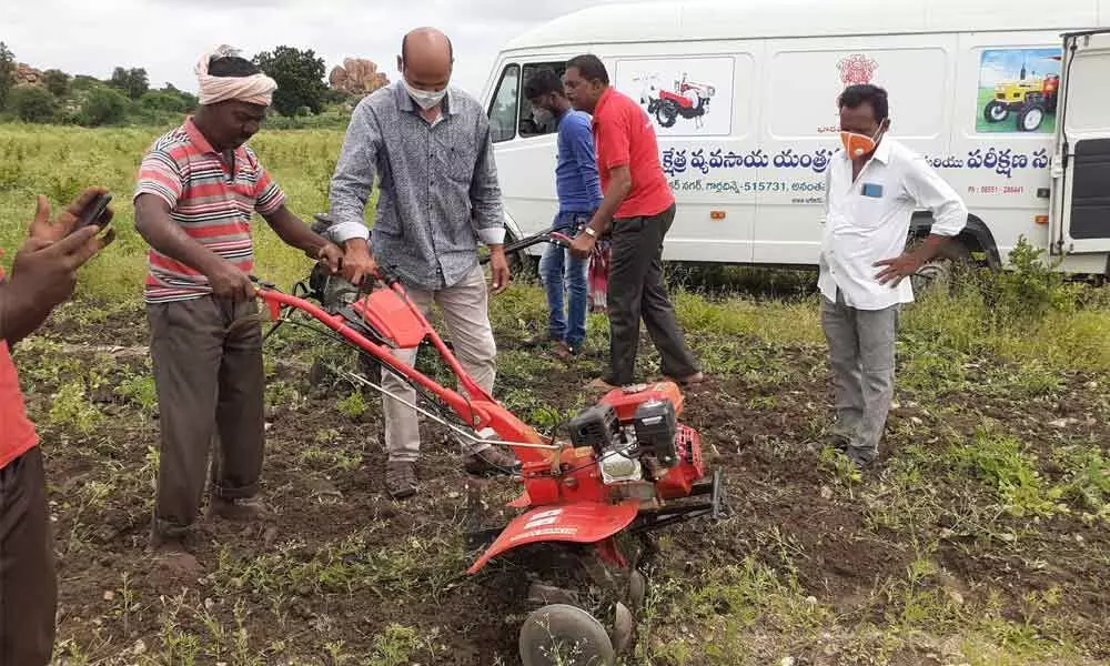 Weeder being tried by a farmer at the training camp in Akhila Farms, Gooty mandal on Thursday