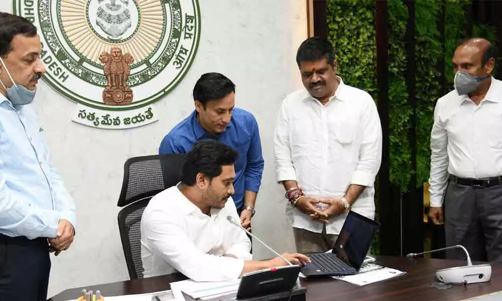 Chief Minister Y S Jagan Mohan Reddy launching AP Tourism online trade registration portal during a review on tourism policy at Tadepalli on Thursday