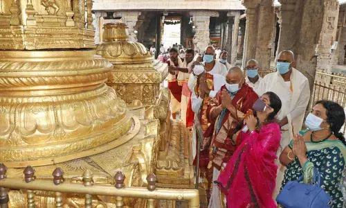 Endowments Minister Vellampalli Srinivas along with family memebrs prays at Dhwja Stambham in Tirumala temple on Friday