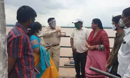 Joint Collector K Venkateswarlu and RDO Swarna Latha taking stock of flood in Bhadrachalam on Sunday