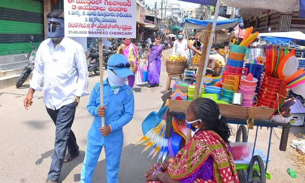A child creating awareness on corona in Vijayawada
