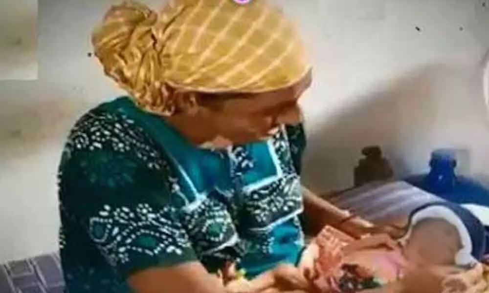 Woman delivers baby at home