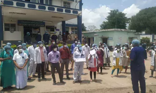 Junior doctors staging a demonstration in front of MGM Hospital in Warangal on Tuesday