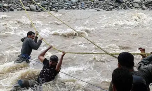 Jammu and Kashmir Police on Wednesday rescued at least 14 persons trapped after a flash flood in parts of Kathua district
