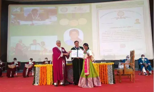 Mumbai NABARD Chairman GR Chintala presenting award to Komatireddy Bhargavi during the graduation ceremony at Jaya Shankar Agriculture University in Hyderabad on Thursday