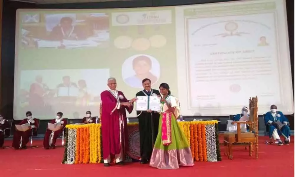 Mumbai NABARD Chairman GR Chintala presenting award to Komatireddy Bhargavi during the graduation ceremony at Jaya Shankar Agriculture University in Hyderabad on Thursday