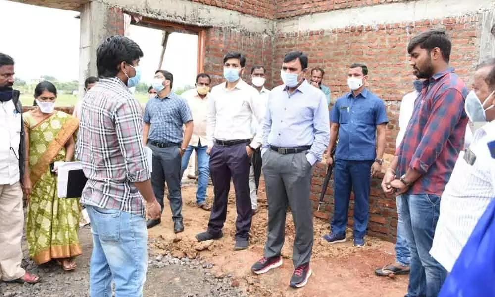 District Collector Dr A Sharath inspecting the construction of Raithu vedika building in Domakonda on Thursday