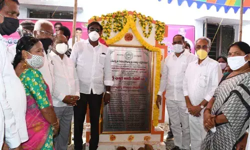 Transport Minister P Ajay Kumar launching double bedroom houses at Julurpad village on Friday