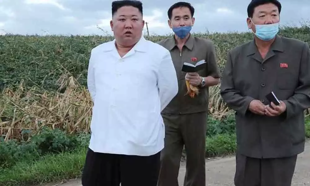 Kim Jong-un visits typhoon-hit area
