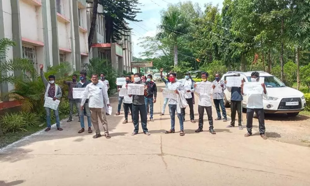 Fishermen staging a protest at ITDA office in Visakhapatnam on Friday