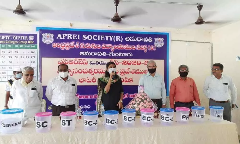 Joint Collector P Prasanthi addressing a meeting on the occasion of conducting lottery for selecting candidates for admission into APREI in Guntur on Friday
