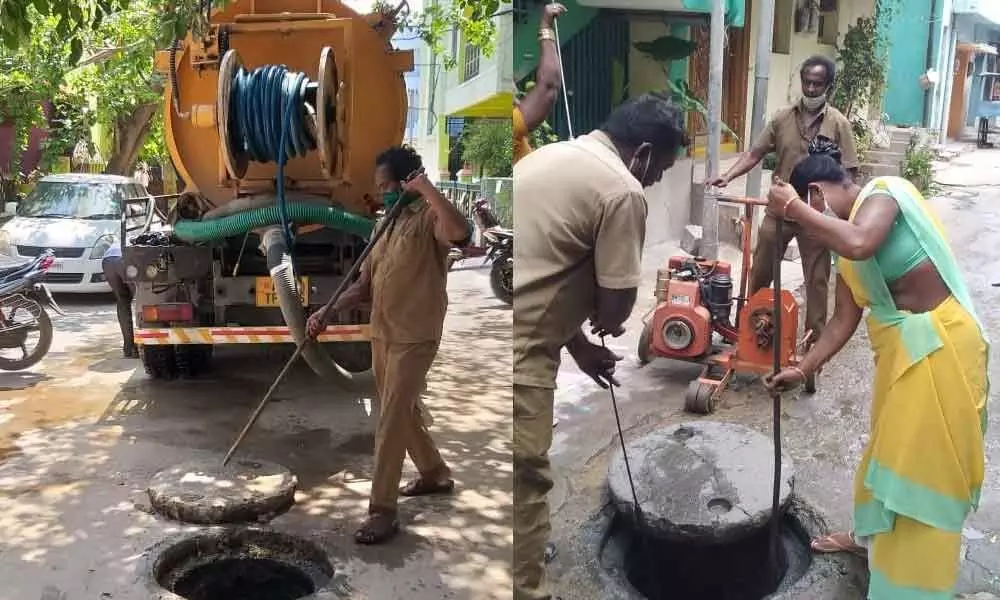 Civic staff carrying out drainage repair works in Tirupati city