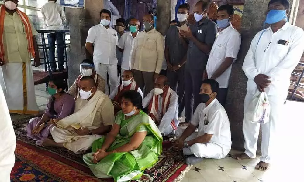 Endowments Minister Vellampalli Srinivas along with his family members at  Sri Lakshmi Narasimha Swamy temple in Mangalagiri on Saturday