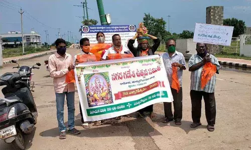 Ganesh Utsav Samithi leaders staging a dharna at Suryapeta beach in Kakinada on Sunday