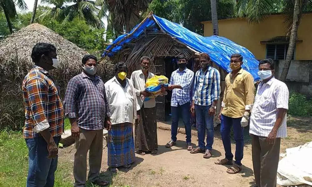 Promise Foundation organizers donating provisions to the poor near Machilipatnam on Sunday