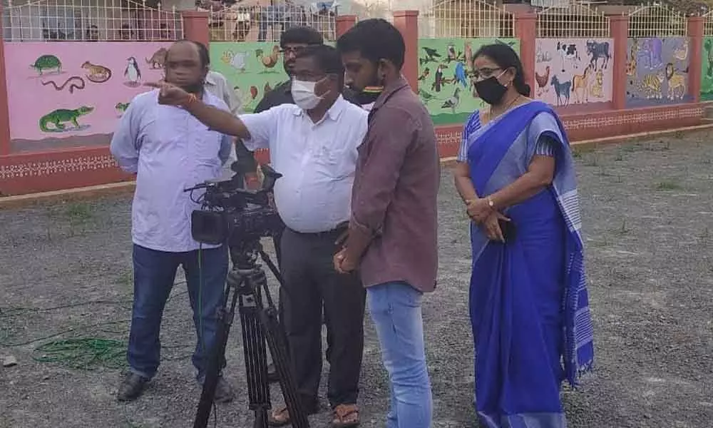 Director of School Education V China Veerabhadrudu directing the shooting of the documentary at Kankipadu in Vijayawada on Monday