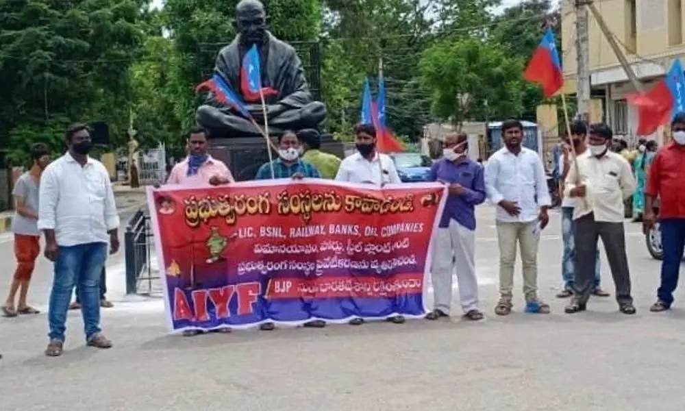 Members of AIYF staging a protest in front of the Collectorate in Kurnool on Monday