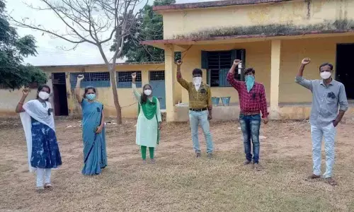 Teachers staging a protest with black badges in Vemulakurthi village on Tuesday