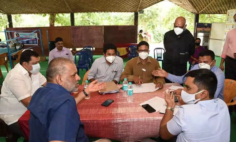 Chittoor District Collector Dr N Bharat Gupta participating in the Covid coordination committee meeting in Tirupati on Tuesday. TUDA chairman Chevireddy Bhaskar Reddy is also seen.