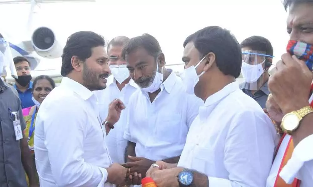 Deputy Chief Minister Amzath Basha receiving Chief Minister Y S Jagan Mohan Reddy at Kadapa airport on Tuesday