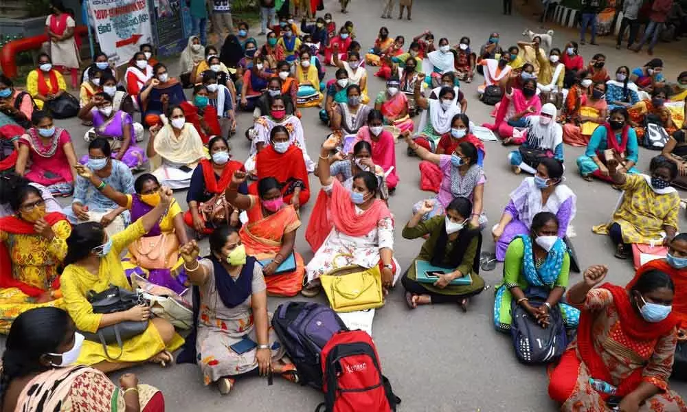 Aspirants for the posts of nurses staging a dharna at Ruia Hospital in Tirupati on Tuesday