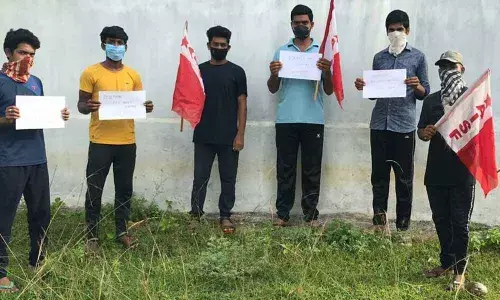 Student Union representatives staging a protest against the Central government decision to conduct JEE and NEET, in Palasa on Wednesday