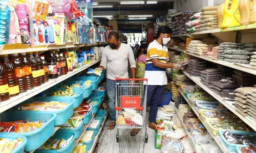 Consumers pick up groceries in Supermarket in Tirupati
