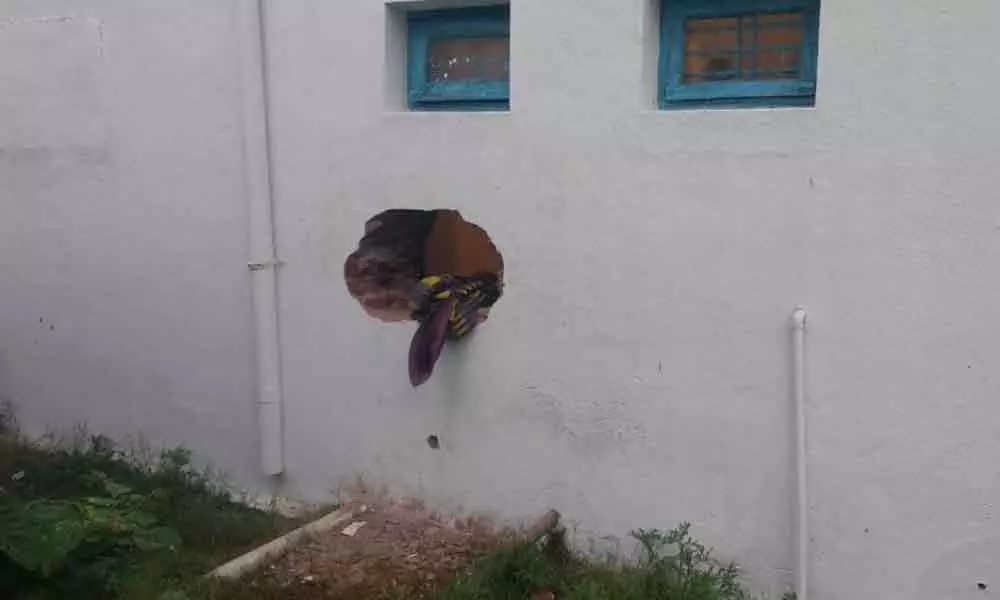 Strangers drilled a big hole to bank wall for entering inside