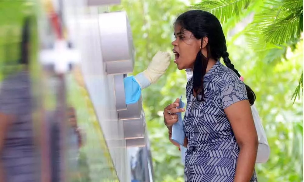 A woman getting tested for coronavirus at Sanjeevini mobile testing facility in Visakhapatnam.