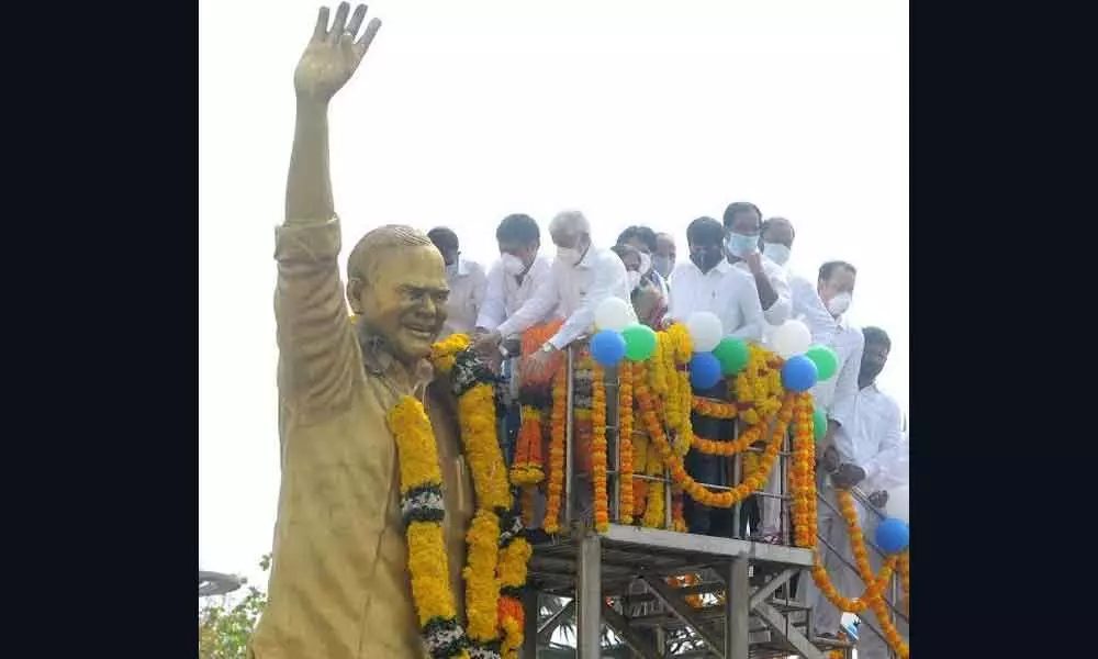 Rajya Sabha MP Vijaya Sai Reddy and Tourism Minister M Srinivasa Rao paying homage to the statue of Y S Rajasekhara Reddy in Visakhapatnam on Wednesday