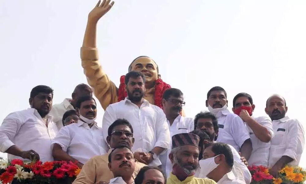Minister Anil Kumar Yadav and other YSRCP leaders offering floral tributes to YSR in Nellore on Wednesday