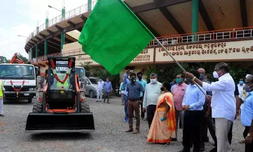 Municipal Administration Minister Botcha Satyanarayana flagging off new vehicles of VMC in Vijayawada on Thursday