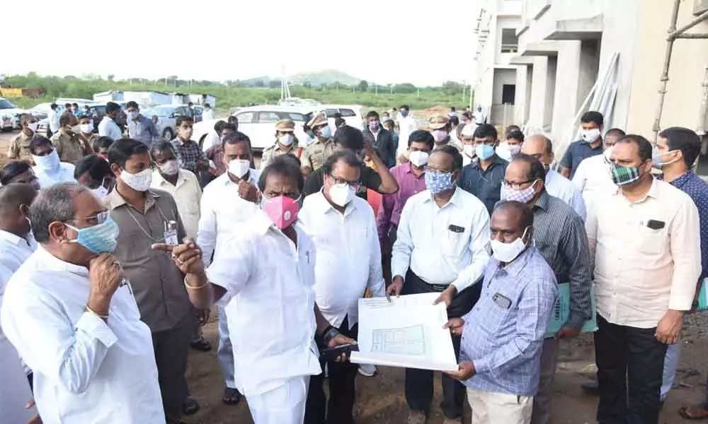 Excise Minister Srinivas Goud and District Collector S Venkat Rao inspecting the construction works of integrated Collectorate building at Palakonda on Friday