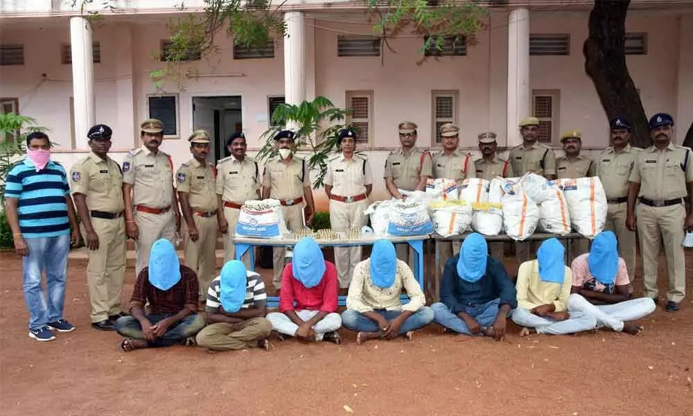 Central zone in-charge DCP K Pushpa producing the arrested seven-member gang along with stolen property before the media in Warangal on Friday