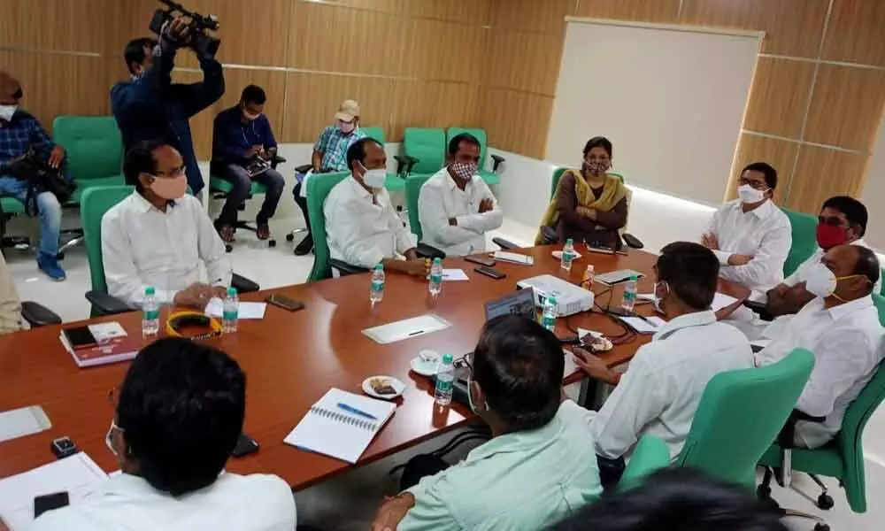NUDA Chairman Prabhakar Reddy at a review meeting with KUDA Chairman Marri Yadava Reddy